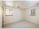 Spacious bedroom with two windows and carpet flooring at 1270 Berea Dr, Boulder, CO 80305