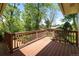 Sunny wooden deck overlooking lush backyard, perfect for outdoor entertaining at 1270 Berea Dr, Boulder, CO 80305