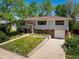 Well-maintained home featuring a concrete driveway and established landscaping in a suburban setting at 1270 Berea Dr, Boulder, CO 80305