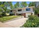 Inviting home with mature trees, a concrete driveway, and a clean, well-kept yard at 1270 Berea Dr, Boulder, CO 80305