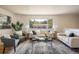Bright and airy living room with ample seating and a large picture window at 1270 Berea Dr, Boulder, CO 80305
