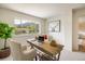 Bright office space with a wooden desk, mountain view, and a cow painting on the wall at 1270 Berea Dr, Boulder, CO 80305