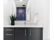 Elegant bathroom featuring a modern vanity, sleek fixtures, and unique bug-themed wallpaper, creating a stylish design at 2530 Lawrence St # Ra101, Denver, CO 80205