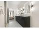 Contemporary bathroom featuring double vanity, sleek fixtures, and stylish tile flooring at 2530 Lawrence St # Ra101, Denver, CO 80205