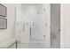 Elegant bathroom shower featuring white subway tile, glass enclosure, and modern fixtures at 2530 Lawrence St # Ra101, Denver, CO 80205