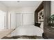 Comfortable bedroom featuring a built-in headboard, closet and a neutral color scheme for a relaxing atmosphere at 2530 Lawrence St # Ra101, Denver, CO 80205