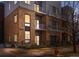 Modern brick apartment building exterior with multiple balconies and manicured landscaping at 2530 Lawrence St # Ra101, Denver, CO 80205