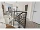 Hallway landing with metal railing, a doorway and access to the balcony area at 2530 Lawrence St # Ra101, Denver, CO 80205