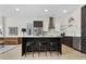 Modern kitchen with sleek cabinets, stainless steel appliances, and a large island with seating at 2530 Lawrence St # Ra101, Denver, CO 80205