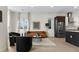 Cozy living area with modern furnishings, including a plush sofa and stylish armchairs at 2530 Lawrence St # Ra101, Denver, CO 80205