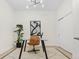 Bright home office with glass desk and sliding door closet at 2530 Lawrence St # Ra101, Denver, CO 80205