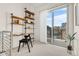 Well-lit office space with shelving, desk, chair, and sliding glass doors to the exterior at 2530 Lawrence St # Ra101, Denver, CO 80205