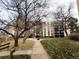 Condo building with green space and a sidewalk at 6960 E Girard Ave # 404, Denver, CO 80224