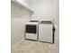 Functional laundry room featuring a modern washer and dryer and plenty of storage space on a shelf at 6960 E Girard Ave # 404, Denver, CO 80224