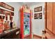 Stylish bar area featuring a vintage Coca-Cola refrigerator and custom signage at 5449 Songbird Way, Parker, CO 80134
