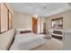 Relaxing bedroom with neutral tones, a comfortable sofa, and natural light from the window at 5449 Songbird Way, Parker, CO 80134