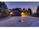 Stately home featuring an oversized three-car garage and expansive driveway at 5449 Songbird Way, Parker, CO 80134