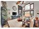 Spacious living room with fireplace, high ceilings, large windows and hardwood floors at 5449 Songbird Way, Parker, CO 80134