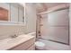 Bright bathroom featuring a shower-tub combo and updated vanity with a mirrored medicine cabinet at 1715 Alkire St, Golden, CO 80401