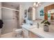 Bathroom featuring updated tile, fixtures and updated shower at 1715 Alkire St, Golden, CO 80401