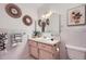 Bathroom featuring updated fixtures, decorative mirrors and plant accents at 1715 Alkire St, Golden, CO 80401