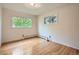 Empty bedroom with hardwood floors, white walls, and bright natural light at 1715 Alkire St, Golden, CO 80401