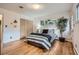 Bedroom with hardwood floors, light walls, and bright natural light at 1715 Alkire St, Golden, CO 80401