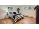 Bedroom with hardwood floors, bright windows, and access to the outside at 1715 Alkire St, Golden, CO 80401