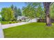 Charming home with a well-maintained lawn and mature trees, creating great curb appeal at 1715 Alkire St, Golden, CO 80401