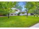 Attractive home with a large front yard and mature trees, showcasing great curb appeal at 1715 Alkire St, Golden, CO 80401