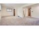 Large living room with neutral carpet and easy access to other rooms at 1715 Alkire St, Golden, CO 80401
