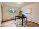 Bright home office with large windows, hardwood floors, and statement rug at 1715 Alkire St, Golden, CO 80401