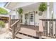 Cozy back porch and steps with wooden deck and natural surroundings for peaceful outdoor enjoyment at 6480 W 60Th Ave, Arvada, CO 80003