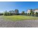 Backyard with a manicured lawn, fence line and view of a residential building at 6480 W 60Th Ave, Arvada, CO 80003