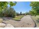 Outdoor recreational area and pump track with manicured landscaping, grass and gravel elements at 6480 W 60Th Ave, Arvada, CO 80003