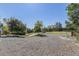 View of fenced backyard and park area with trees and picnic tables at 6480 W 60Th Ave, Arvada, CO 80003