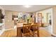 Bright dining area connected to the kitchen with hardwood floors and natural light perfect for hosting gatherings at 6480 W 60Th Ave, Arvada, CO 80003