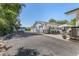 Large driveway and parking area leading to a detached garage with ample space for vehicles and outdoor activities at 6480 W 60Th Ave, Arvada, CO 80003