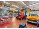 Spacious garage with car lifts, ample storage, and room for multiple vehicles or projects at 6480 W 60Th Ave, Arvada, CO 80003