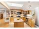 Well-lit kitchen with modern appliances, skylight, and functional island perfect for Gathering meals and entertaining at 6480 W 60Th Ave, Arvada, CO 80003