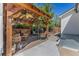 Inviting pergola with seating, grill, and decor in a backyard setting at 6480 W 60Th Ave, Arvada, CO 80003