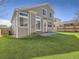 Exterior view of the house with artificial turf and flagstone patio at 16564 High Desert Way, Parker, CO 80134
