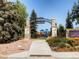 Welcoming entrance to Old Town Parker's O'Brien Park with stone pillars and a view of the playground at 16564 High Desert Way, Parker, CO 80134