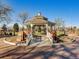 Beautiful gazebo in a park setting, complete with holiday decorations and landscaping at 16564 High Desert Way, Parker, CO 80134