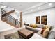 Modern living room featuring a spacious layout and convenient staircase access at 2495 S Madison St, Denver, CO 80210