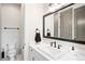 Tasteful bathroom with sleek fixtures, a spacious vanity, and ample storage at 2495 S Madison St, Denver, CO 80210