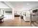 Spacious, open-concept floor plan flows seamlessly from living area to kitchen at 2495 S Madison St, Denver, CO 80210