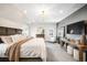 Inviting main bedroom with king bed, dresser, and a stylish modern chandelier at 2495 S Madison St, Denver, CO 80210