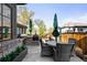 Backyard with outdoor kitchen featuring built-in grill and ample seating for entertainment and dining at 2495 S Madison St, Denver, CO 80210