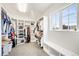Well-organized walk-in closet with custom shelving and storage solutions by a window at 2495 S Madison St, Denver, CO 80210